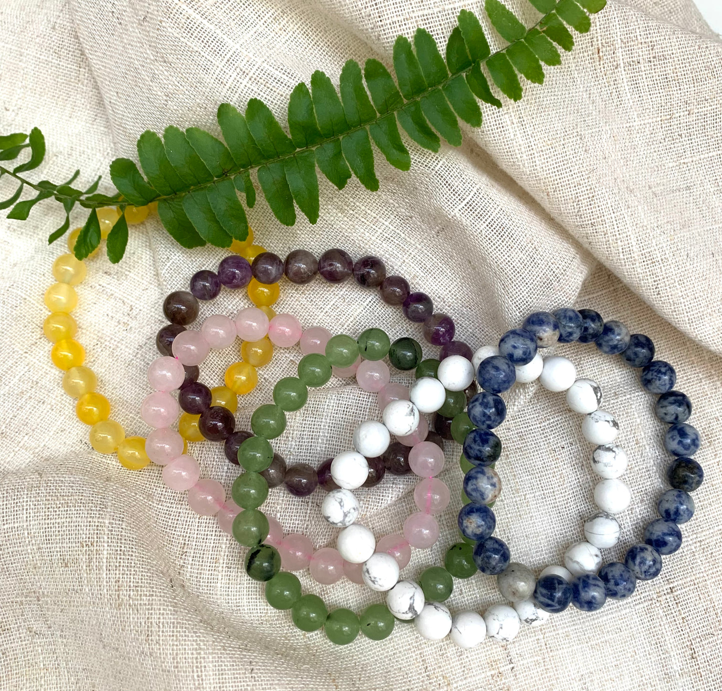 Gemstone Bracelets  £10  Beautiful elasticated bracelet with smooth rounded stones  Each gemstone carries different properties.  Amethyst, Honey Crystal, Jade, Rose Quartz, Sodalite, White Jasper  This is a fairly traded product.