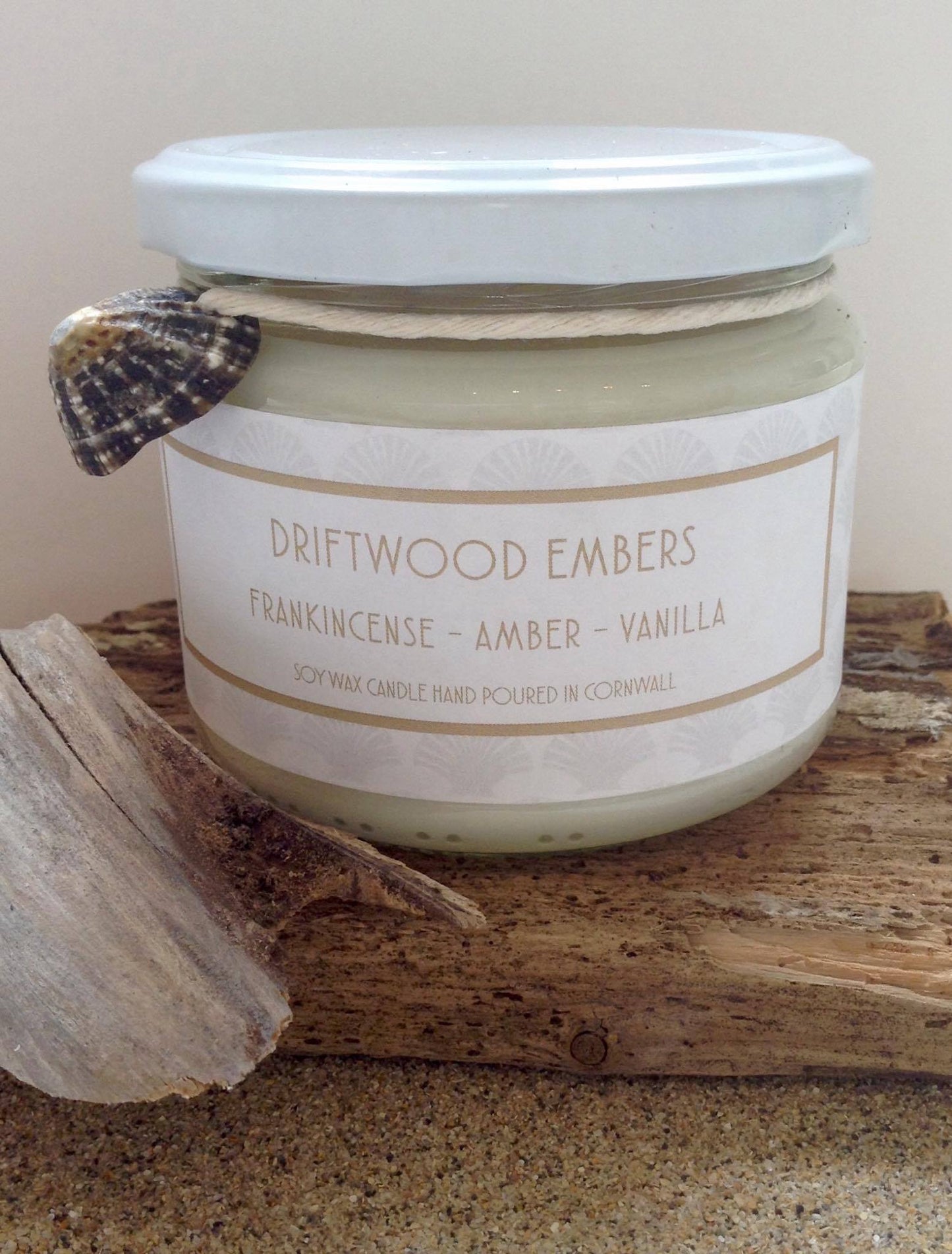 Driftwood Embers Candle  Frankincense - Amber - Vanilla  &nbsp;£20  Citrus top notes lead to a heart of musky spices resting on a warm vanilla base  Ingredients: natural plant wax, fragrance oils  Shell may vary to image shown  &nbsp;Double wicked plant wax candle . Burns for approx 40 hours. Made in Cornwall by Seawitch Candles  " Cosy and comforting with a hint of smokiness. We have bought 6 and counting! Our favourite candle ever." - Joe and Deb