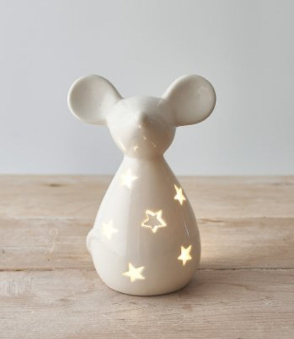 Mouse Tea Light Holder – White  £12.00  A charmingly simple ceramic mouse tea light holder with cut out star detail  Place a T-light inside and watch the flickering flame project a charming starry shadow  Comes complete with LED T-Light  Size is approx 14.5cm x 10.5cm